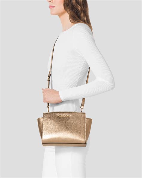 michael kors selma gold medium|Michael Kors selma medium messenger.